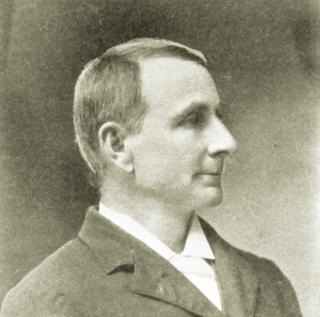 A black and white portrait of TCU founder Addison Clark in 1897