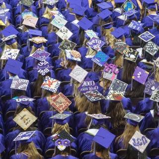 Overhead view of TCU nursing graduates' decorated caps at Commencement