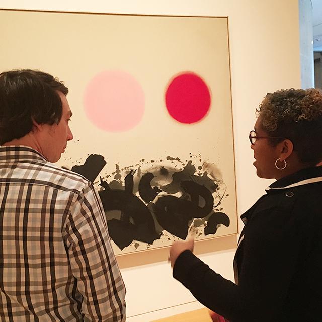 Two TCU students view a painting at Fort Worth's Modern art museum